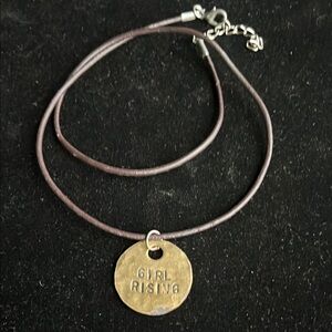 Gold Pendant Necklace States “Girl Rising & Stand With Her”